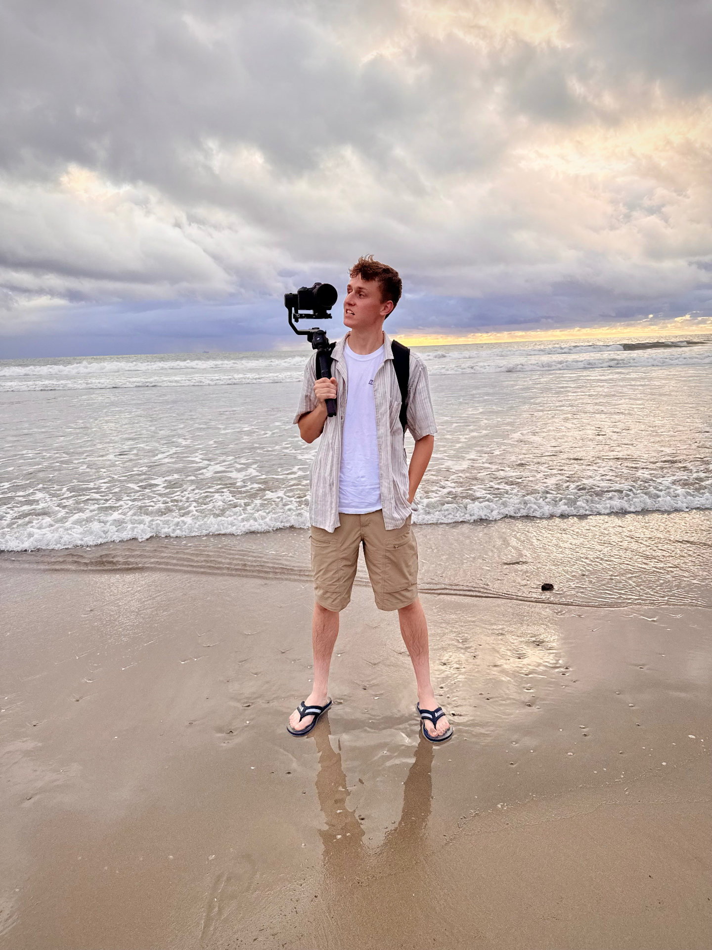 Drew Whimpey filming on beach